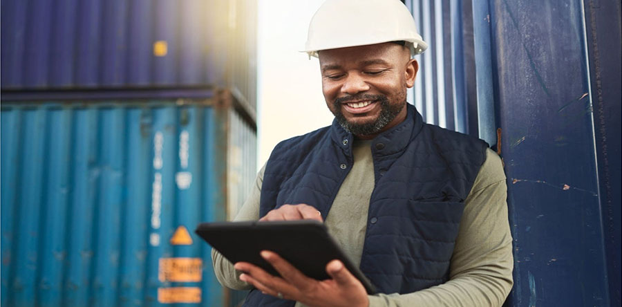 Man with tablet wearing hard hat